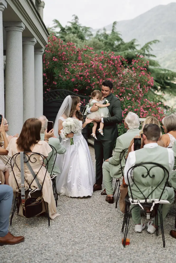 bride, groom an dtheir chid after the ceremony in a private venu in Lake Como