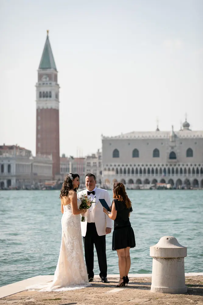 The couple and celebrant at a Public spot in San georgio island in Vencie
