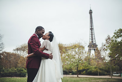 A ceremony for the couple kissing in the champ de mars garden
