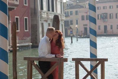 Couple kisses after celebrating their love without alcohol in Venice, Italy