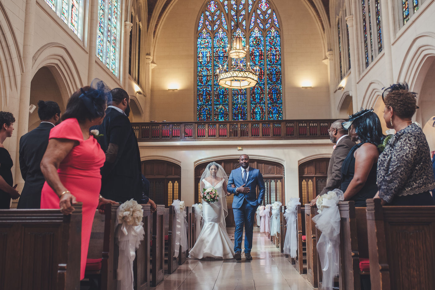 bride and her father walking the aisle in American church in Paris