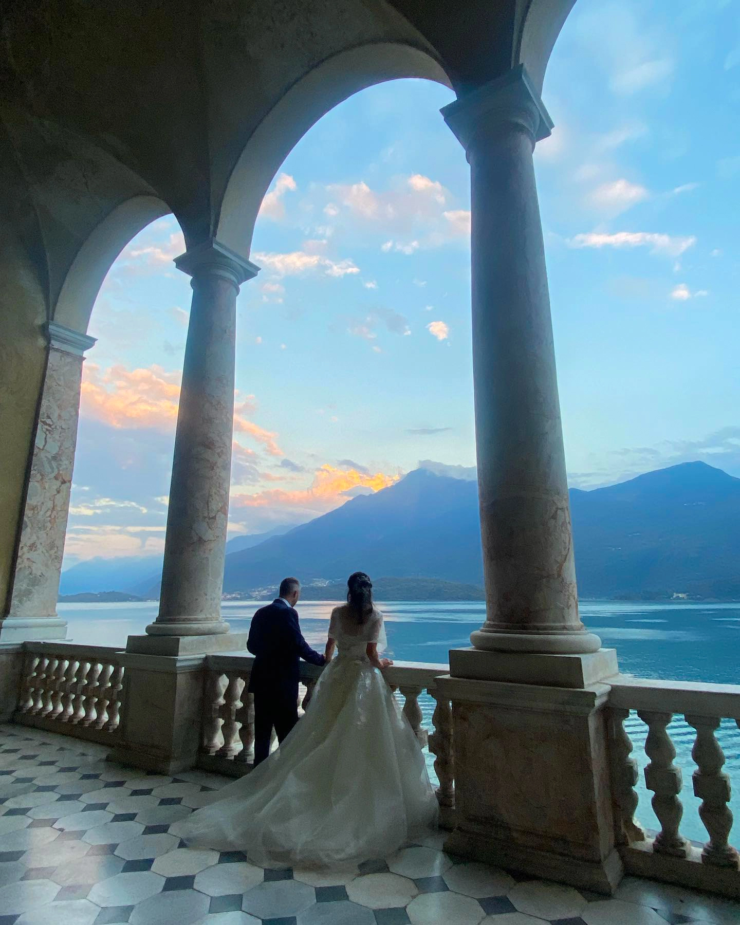 sunset at lake como, the luxuriant columns of this balcony gives a special charm to this location