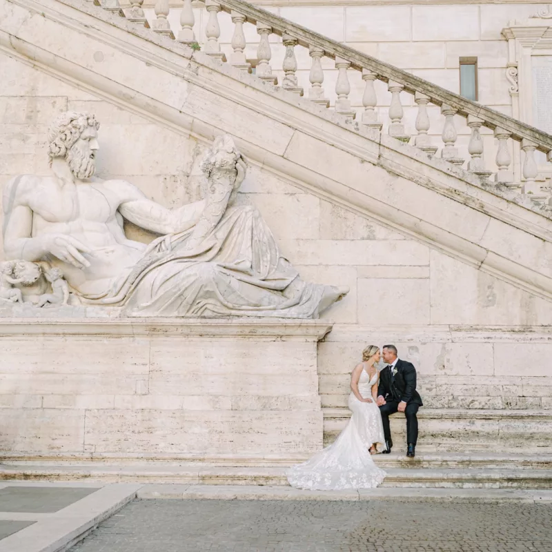Facing each other, the couple at the stair case of Capitol in Rome