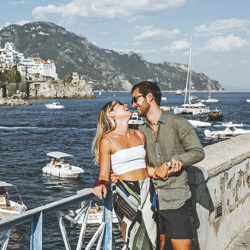 the couple on a balcony after their renew of vows in Amalfi