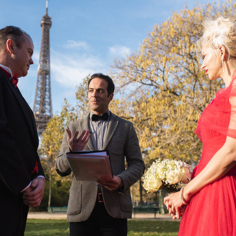 The couple facing each other for their vow renewal ceremony in Paris