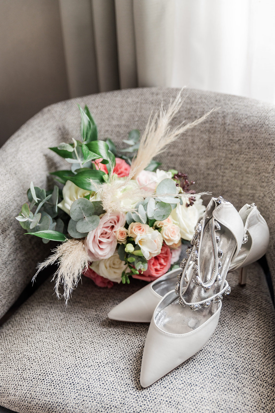 Bouquet and shoes of the bride in perfect consistency