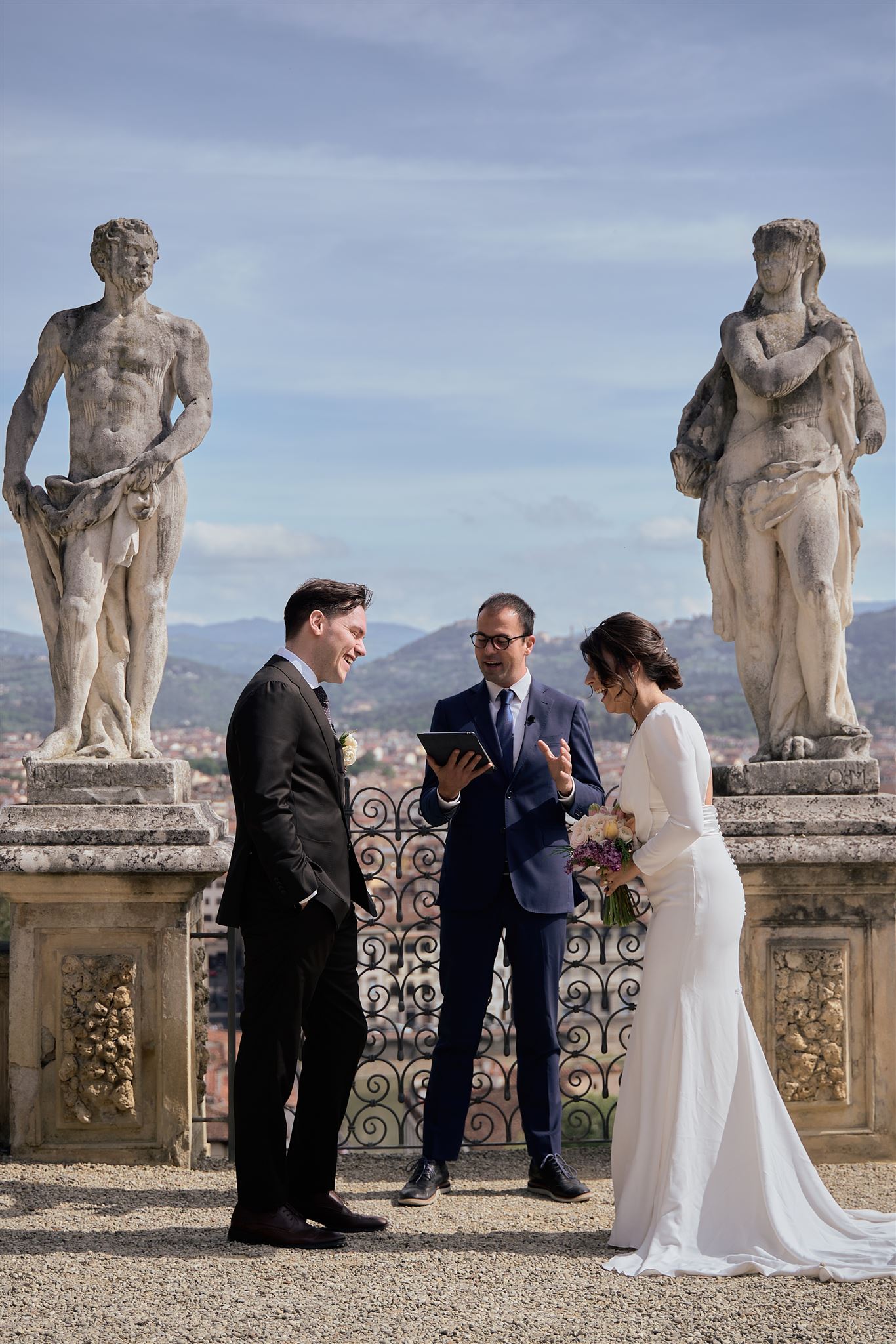 The couple during the exchange of vows in Florence rose gardens