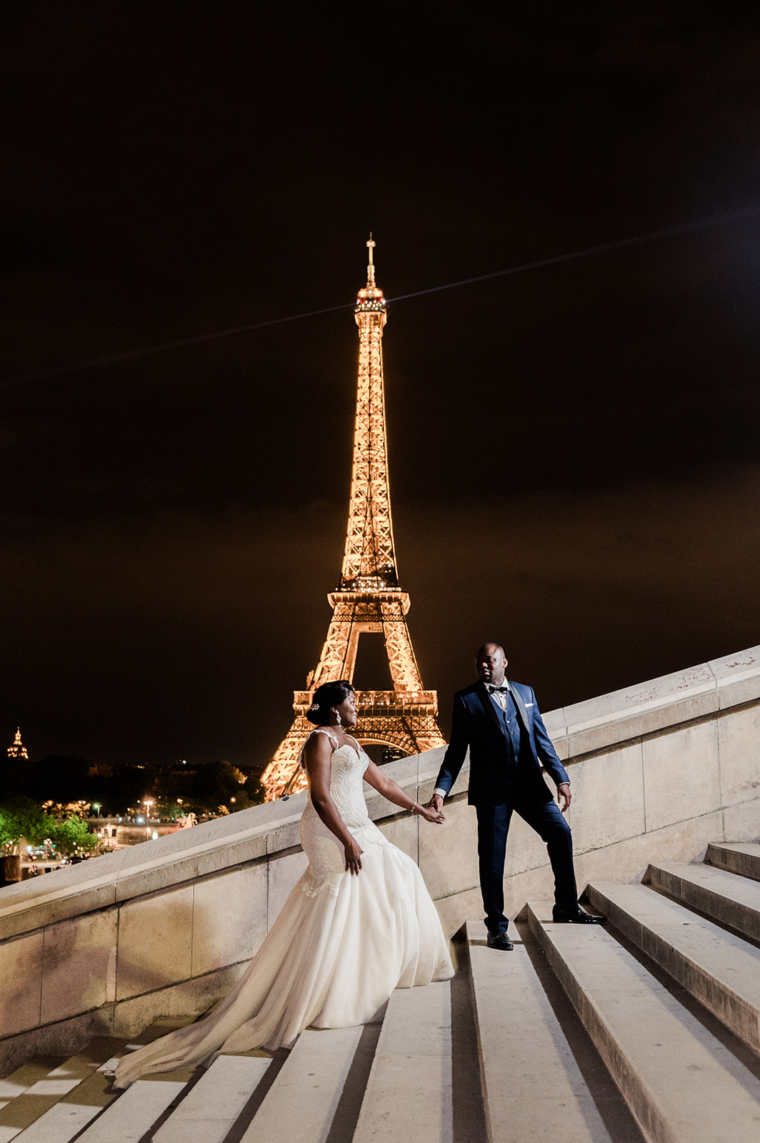 The famous stairs at Trocadero by night with bride and groom