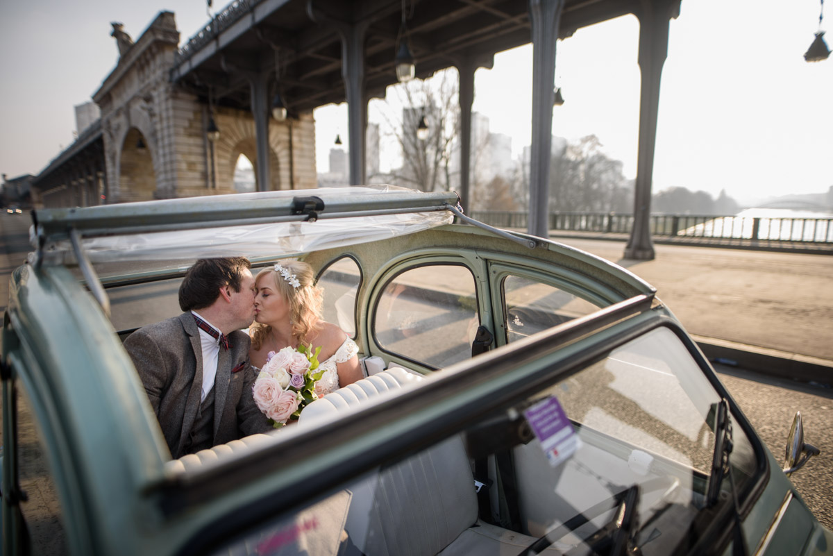 A kiss in the old french car at Bir Hakeim bridge