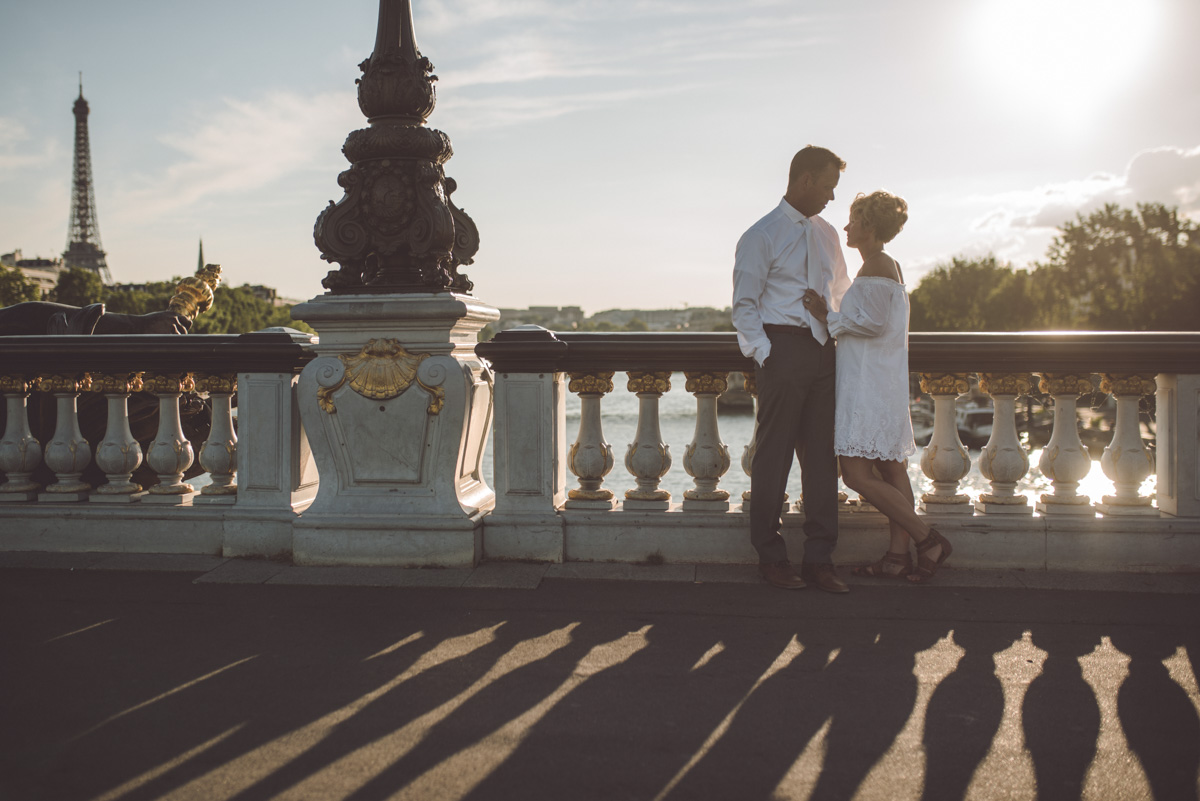 Sunset and Silhouette of bride and groom at Alexandre III bridge