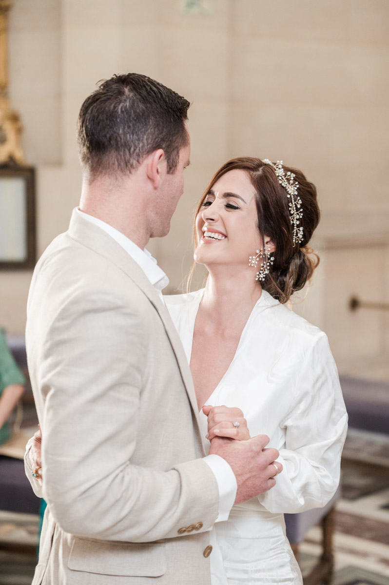 bride and groom smiling during the celebration