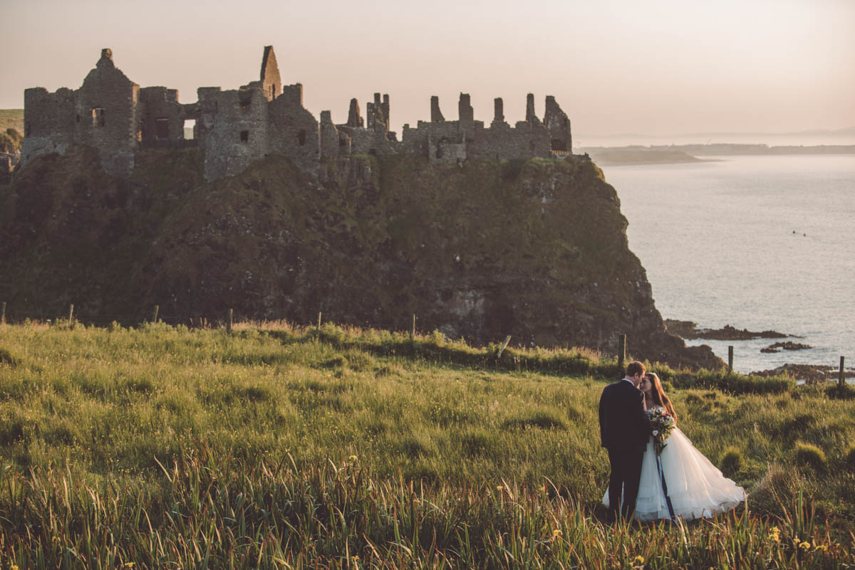 Sunset in Ireland for the couple, with a castle in the background