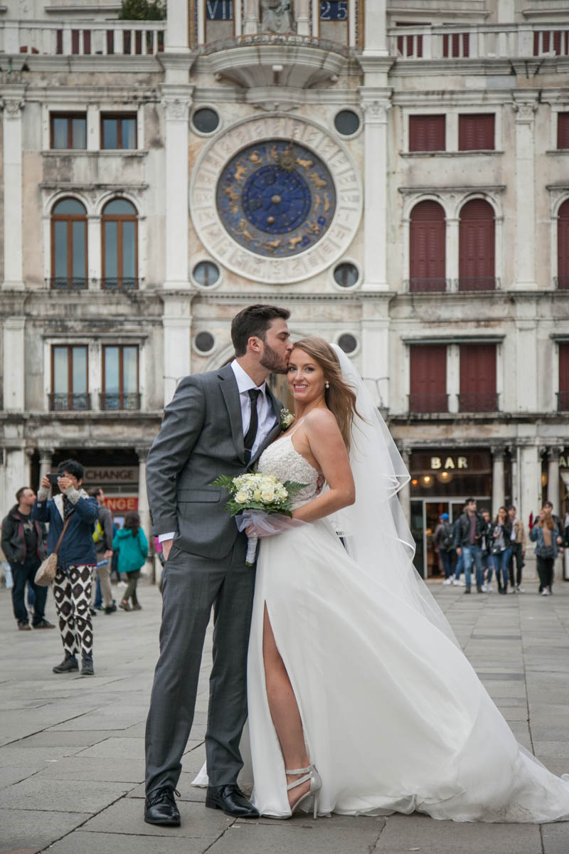 The couple posing in Place St Marc in venice