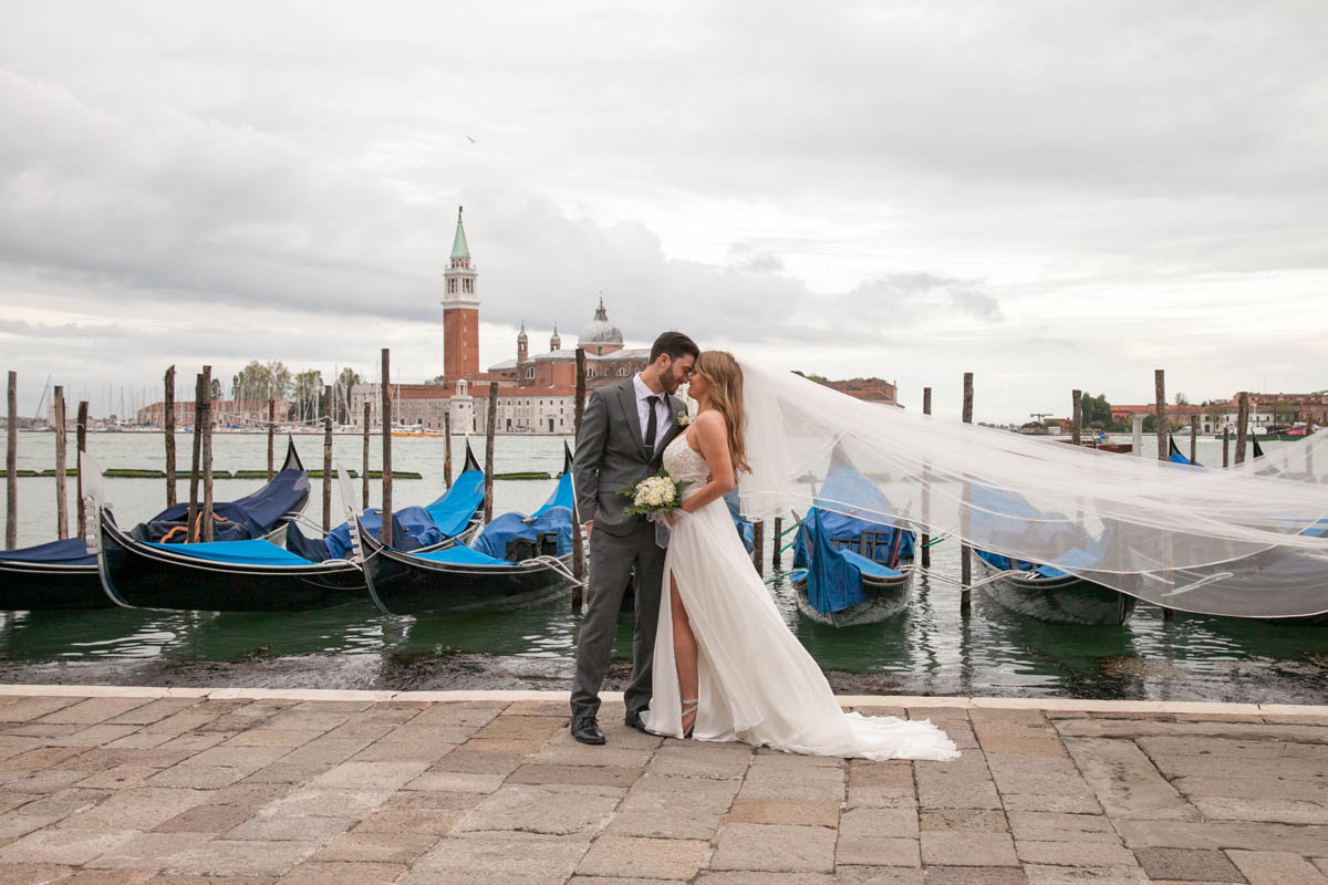 A great shot for the couple in front of the canals and the gondolas as backdrop