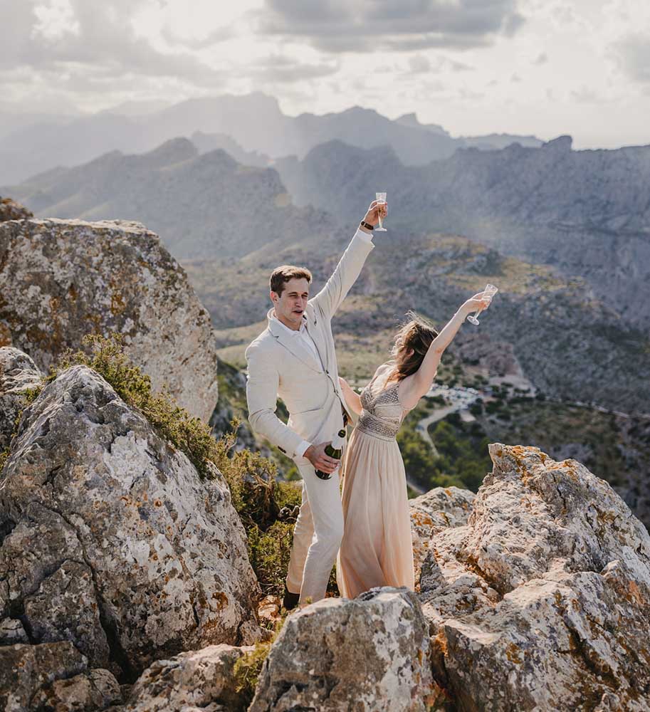 Happiness of the couple above the cliff after their elopement
