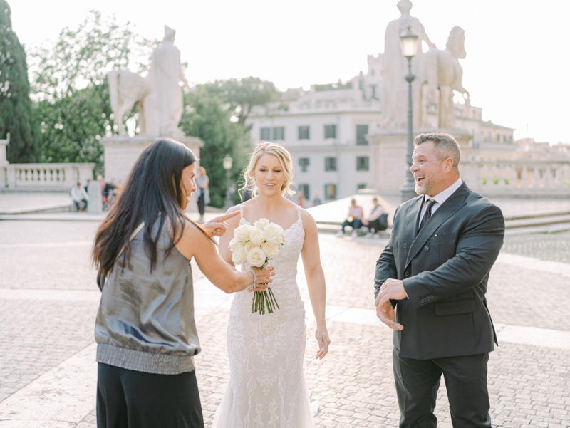 the celebrant bring the flower bouquet to the bride before the ceremony at the meeting point