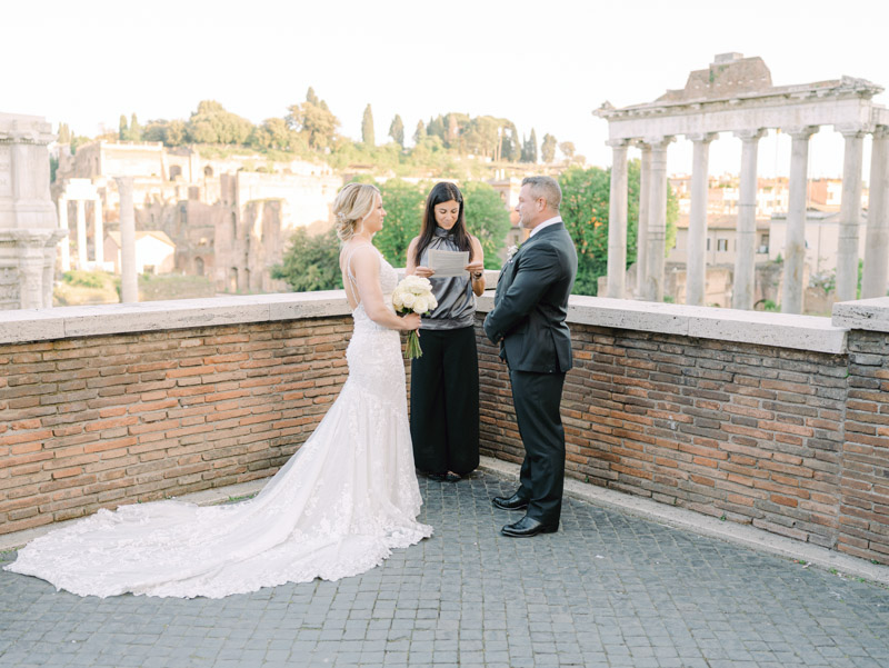 bride and groom hand to hand at Roman forum