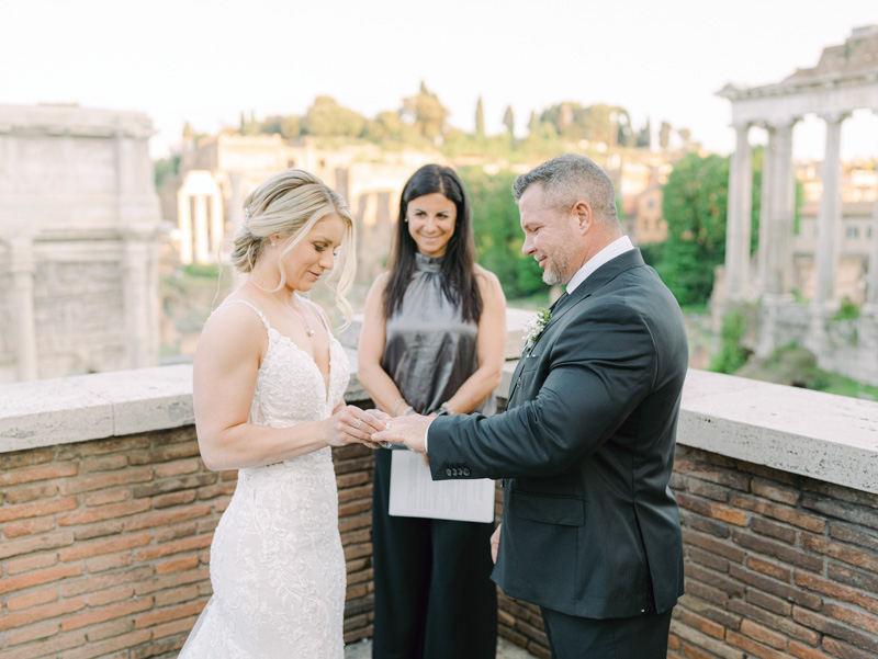 the bride slides the ring to the groom finger