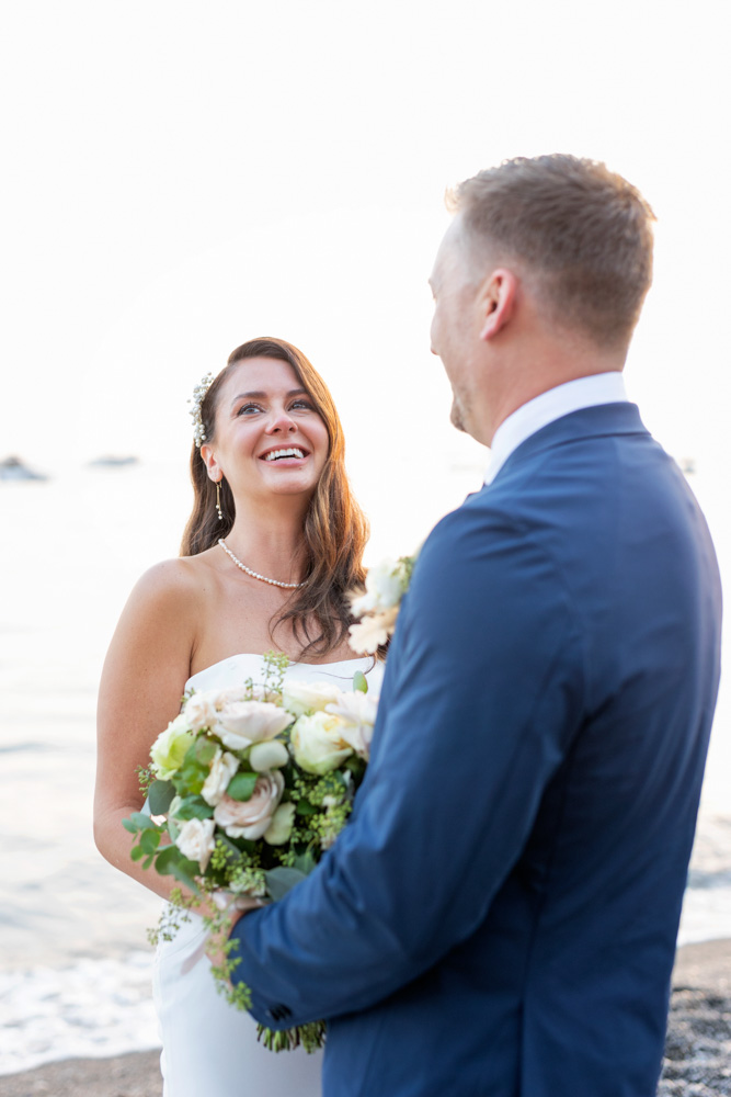 The bride laughing when the celebrant tells their story and their first meet.