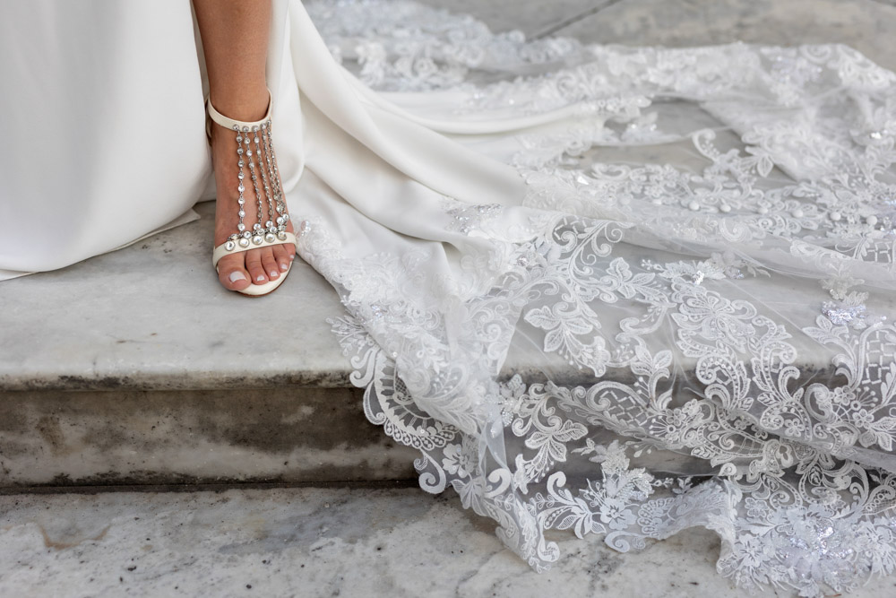 details of the shoes and tail of the bride dress