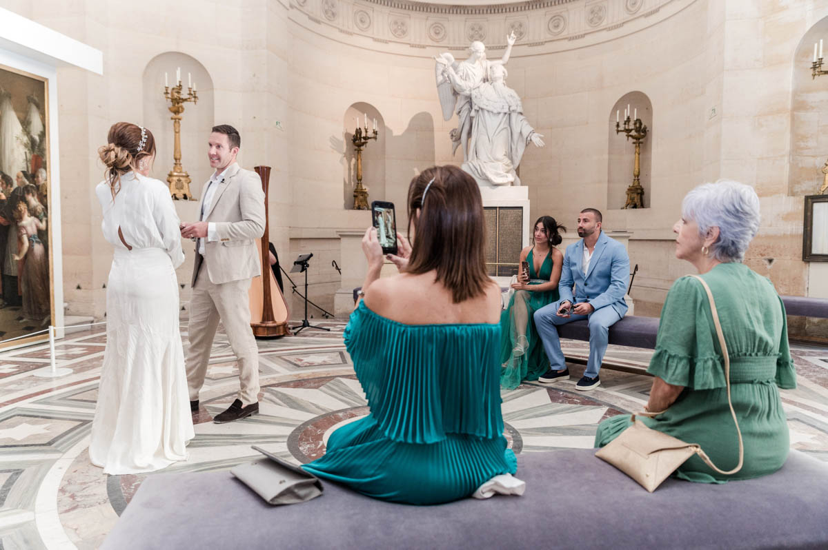 family around the couple in chapelle expiatoire in Paris