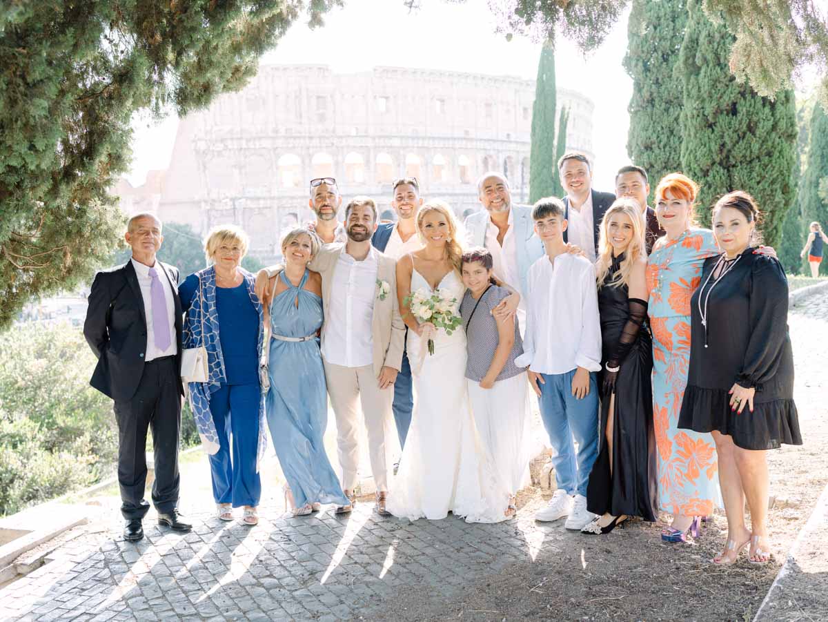 The family together in Rome in front of Colosseum