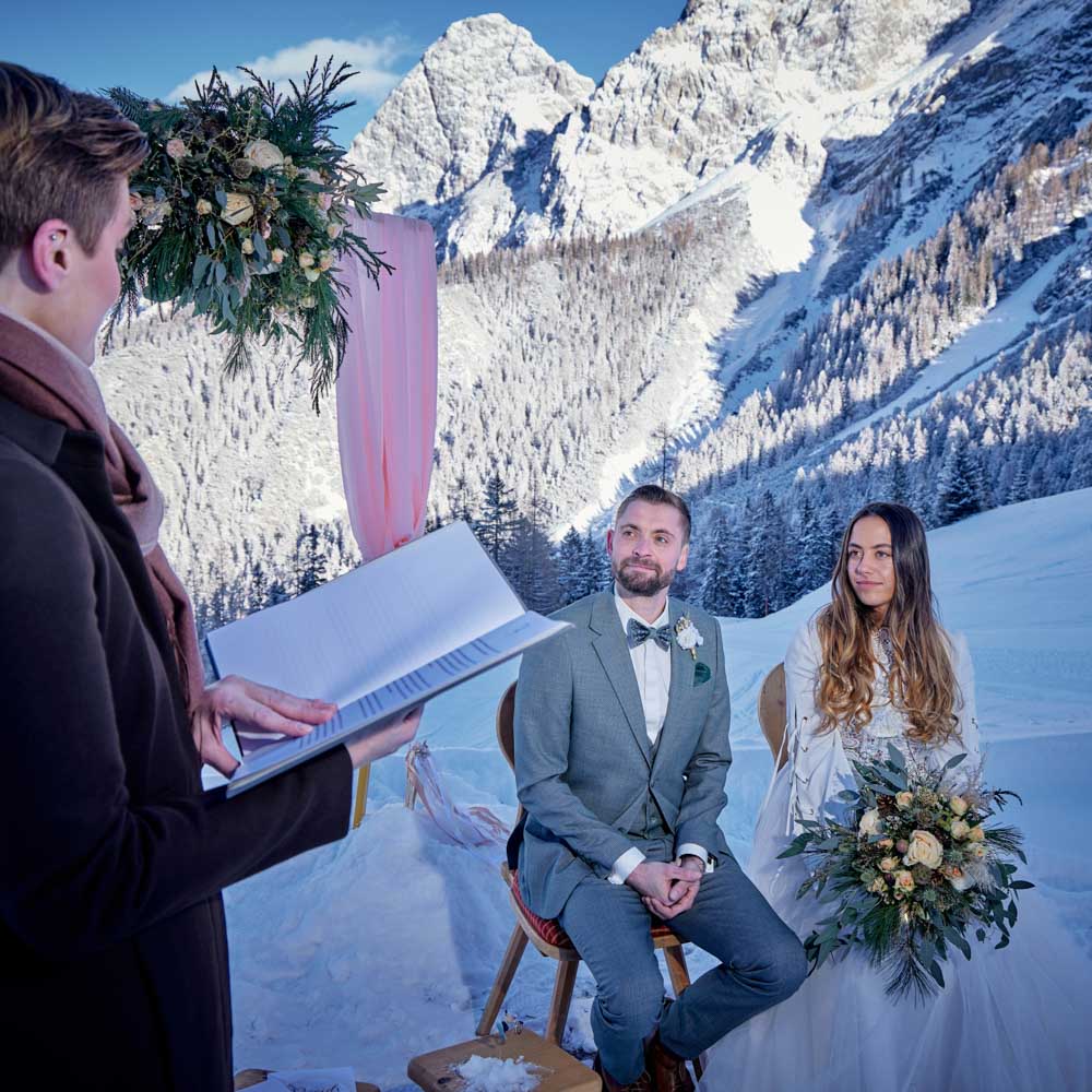 the celebrant telling their story during the wedding ceremony