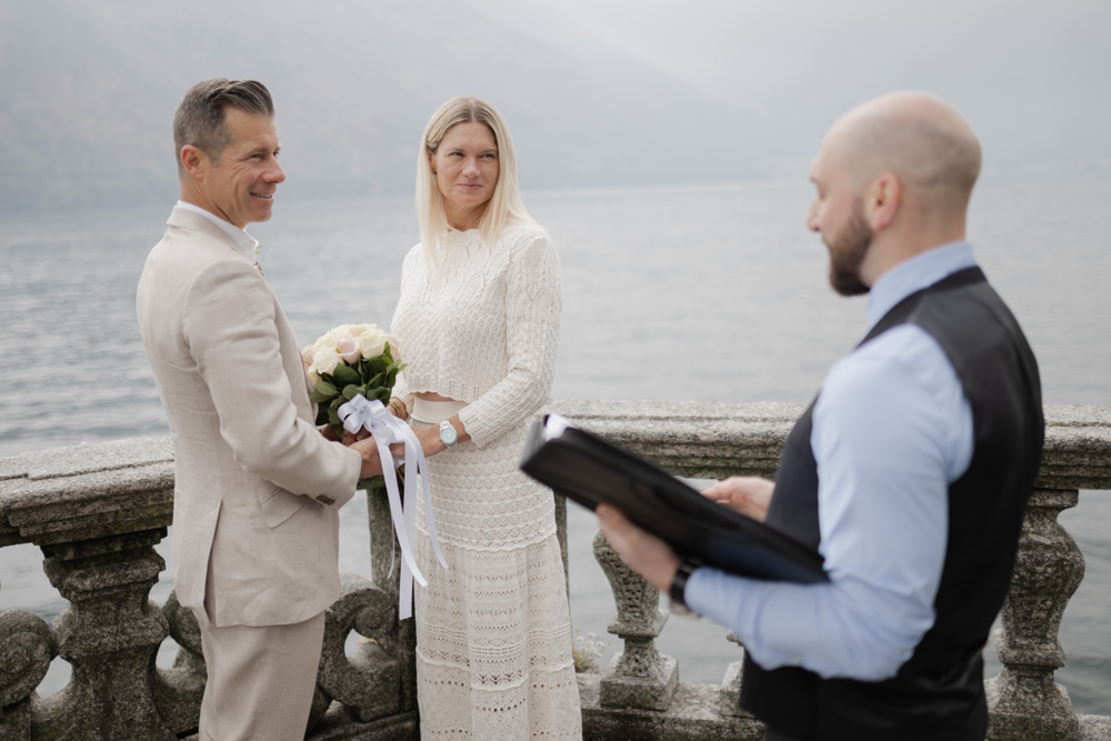 the couple smiles listening the celebrant