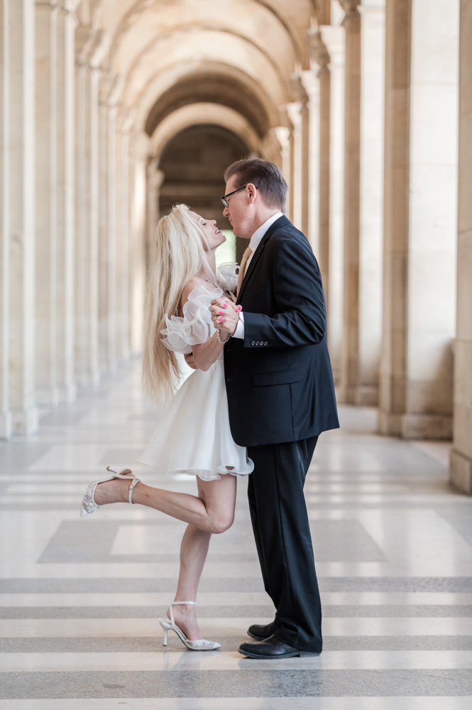 Couple dancing at Louvre corridor