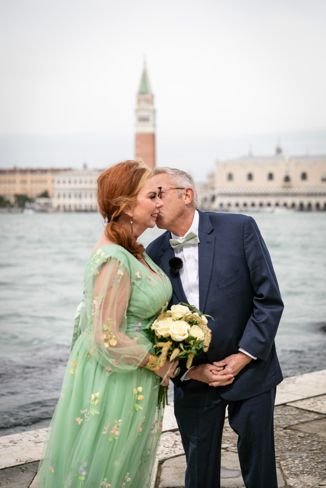 the groom kiss the bride during the ceremony, a lot of emotion