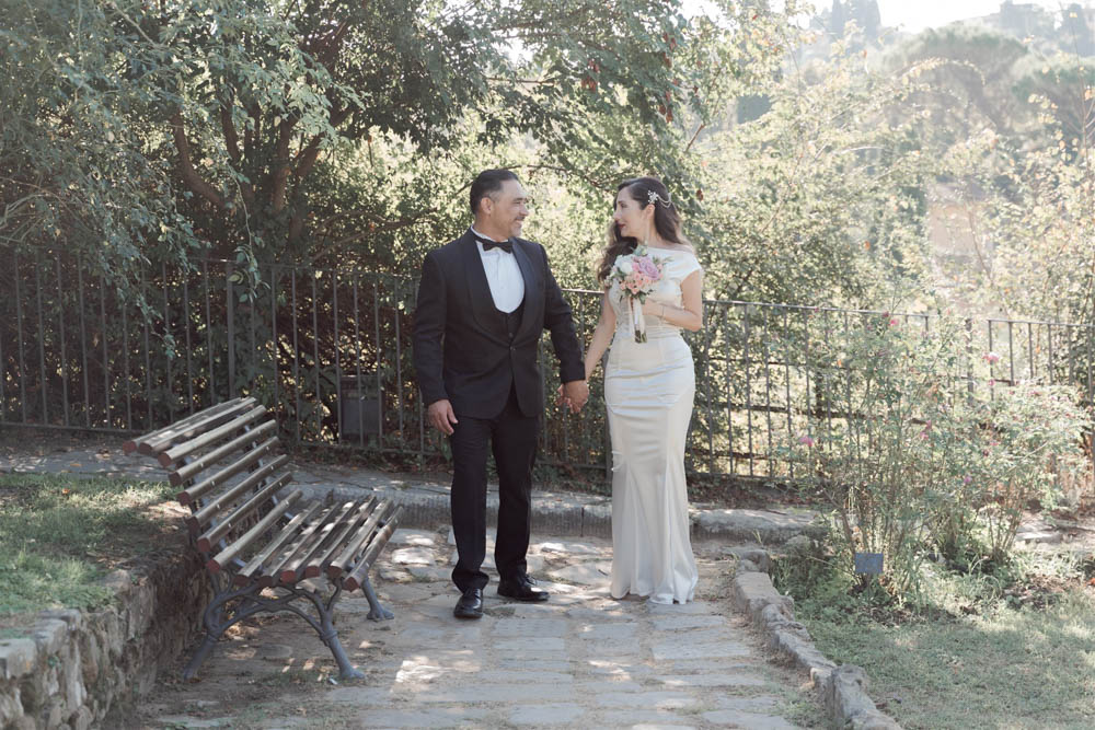 a peace moment in the garden after their wedding Florence