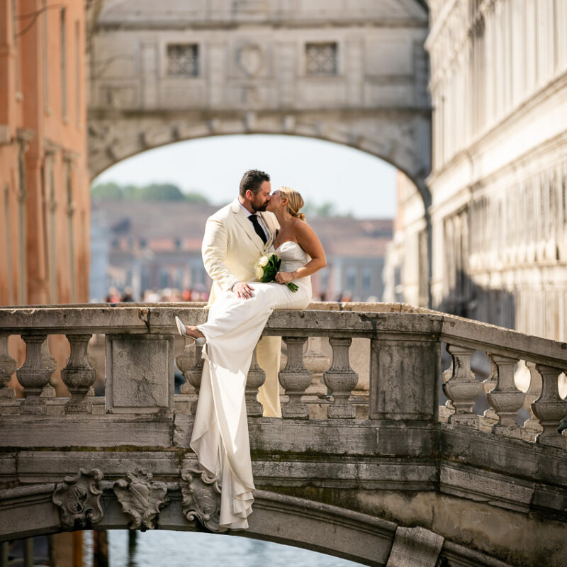 Wedding in Italy-111 The couple in a lovely pose on a bridge in Venice