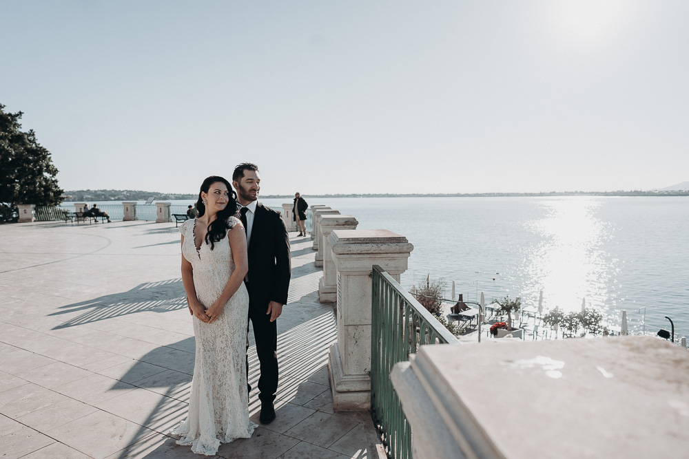 elopement wedding in Sicily-00933-012 Right after the ceremony, the couple stands facing the see surrounded by the blue sky