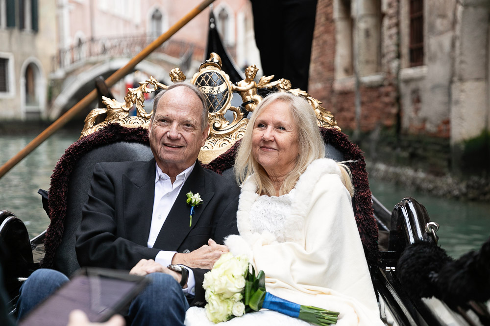 The celebration of Vows renewal on a gondola in venice