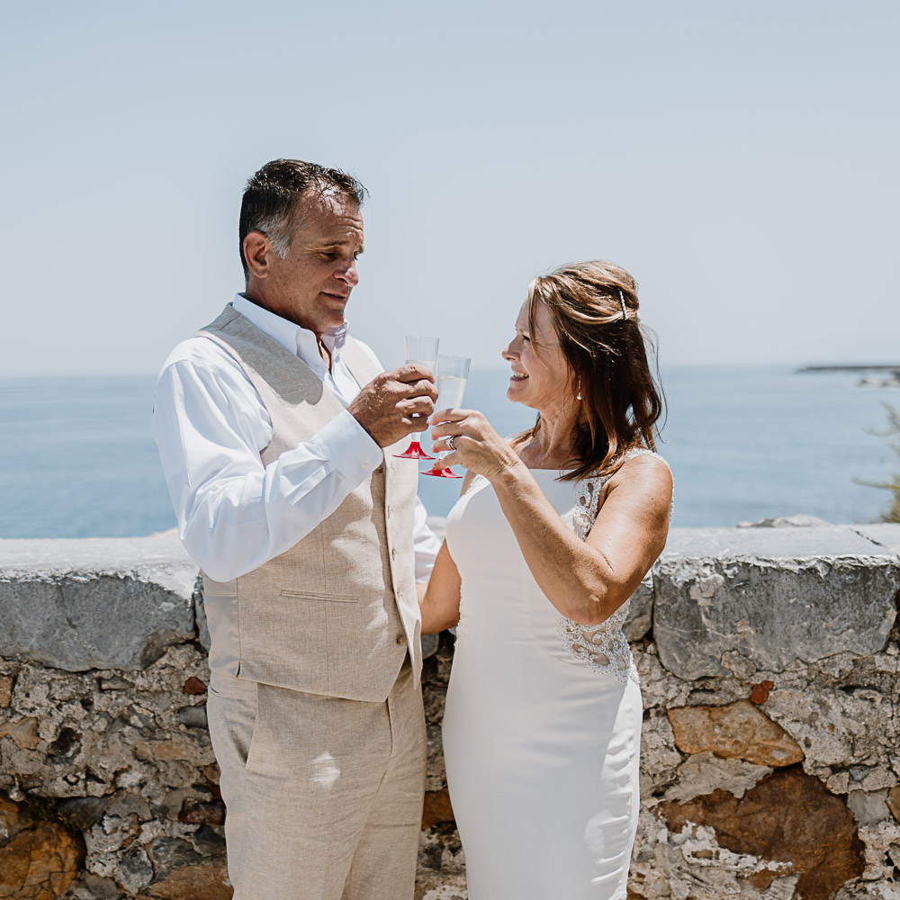 the couple celebrates their renew of vows in Sicily with a glass of Prosecco