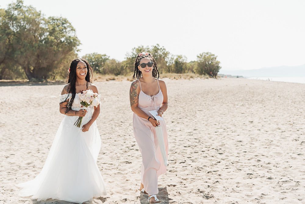 The bride arrives at the beach for the wedding ceremony in Chania, Crete