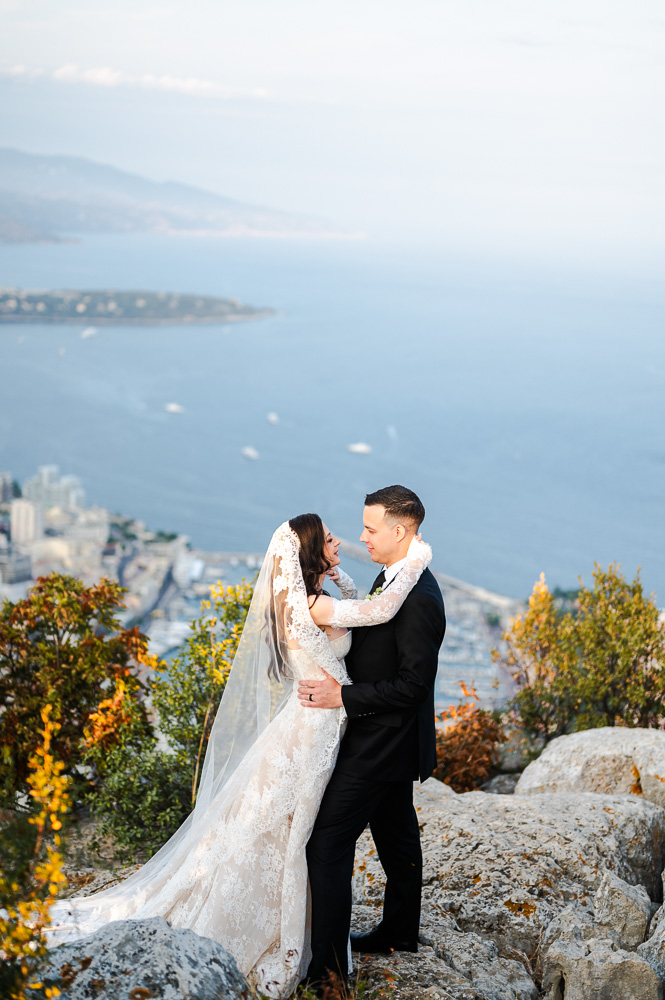 bride ansd groom embraced each other with a great view on Monaco