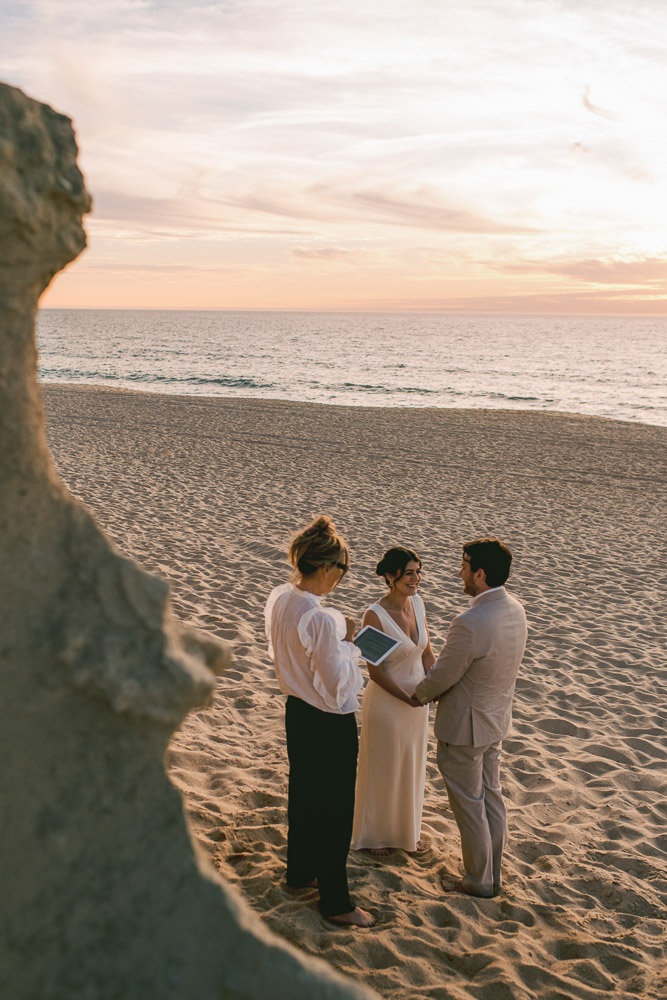 The ceremony with the celebrant, on the beach of Sesimbra at Sunset