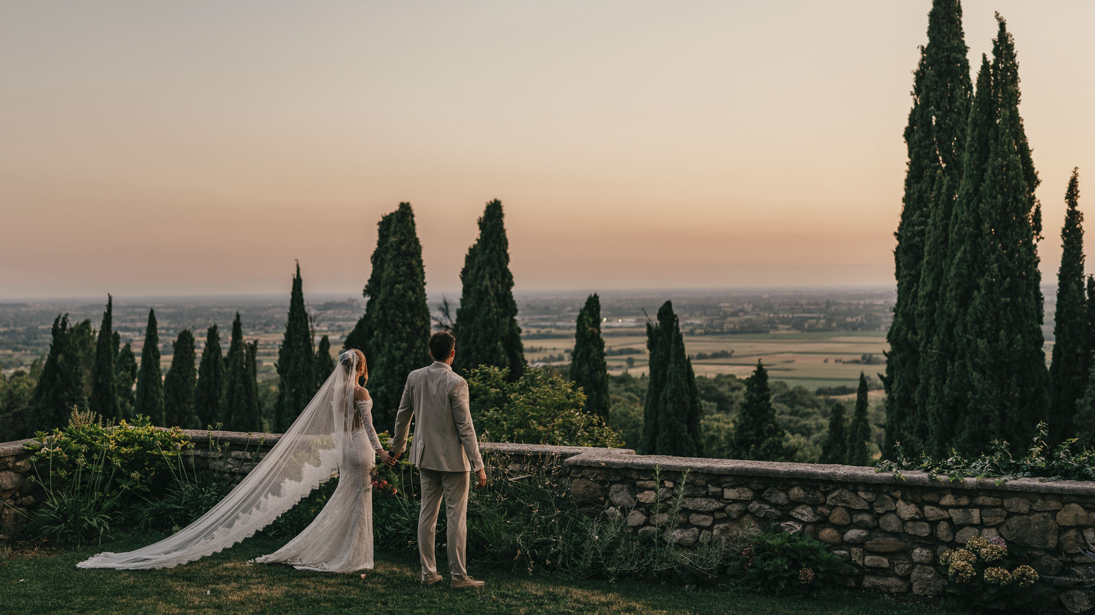 The couple at sunset for a magnificent view on the valley near Verona