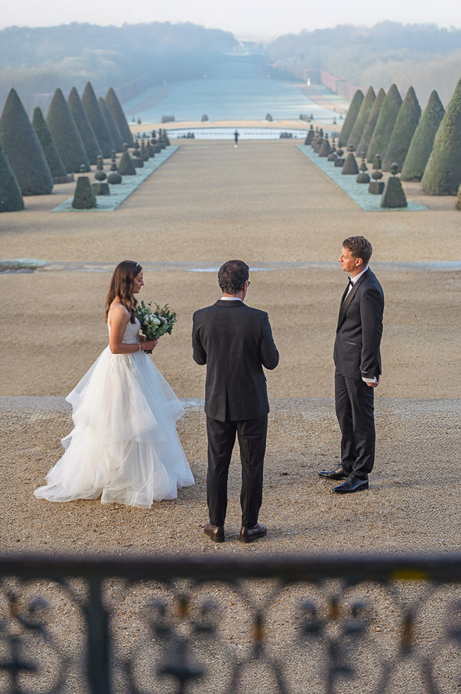 winter wedding in Paris – 0074 the couple and the celebrant for A winter ceremony in Chateau de Sceaux, near paris