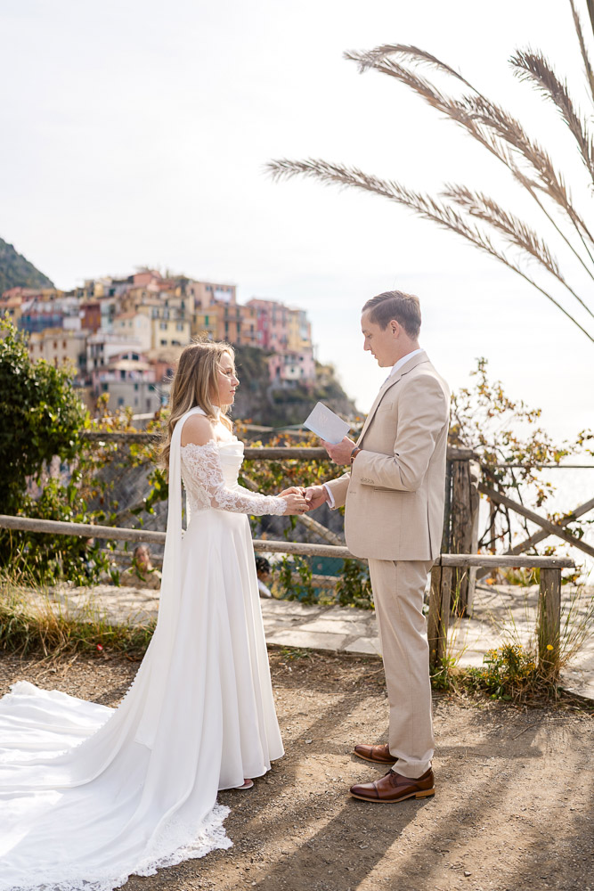 elopement in Cinque Terre-09 The groom reads his vows for the elopement ceremony in Cinque terre