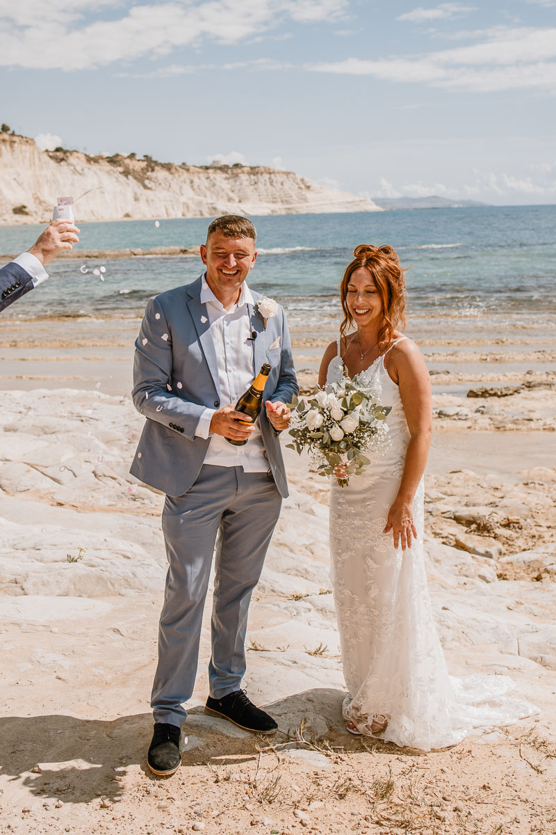 They enjoy a drink of Prosecco when their friend put flowers on them