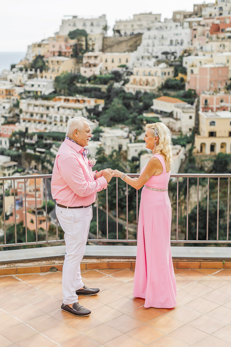 Wedding vow renewal on private terrace with Positano village and Mediterranean Sea