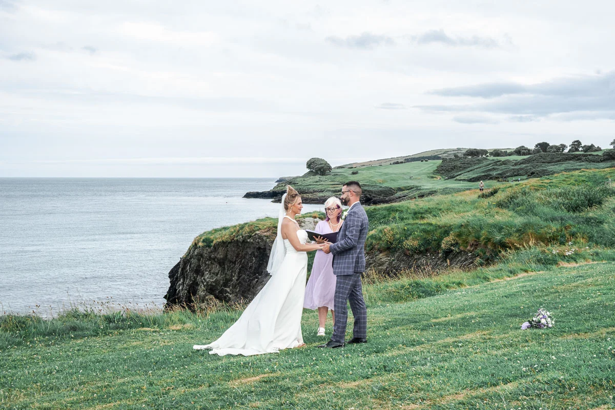 Ireland wedding ceremony with officiant at Black Castle cliff