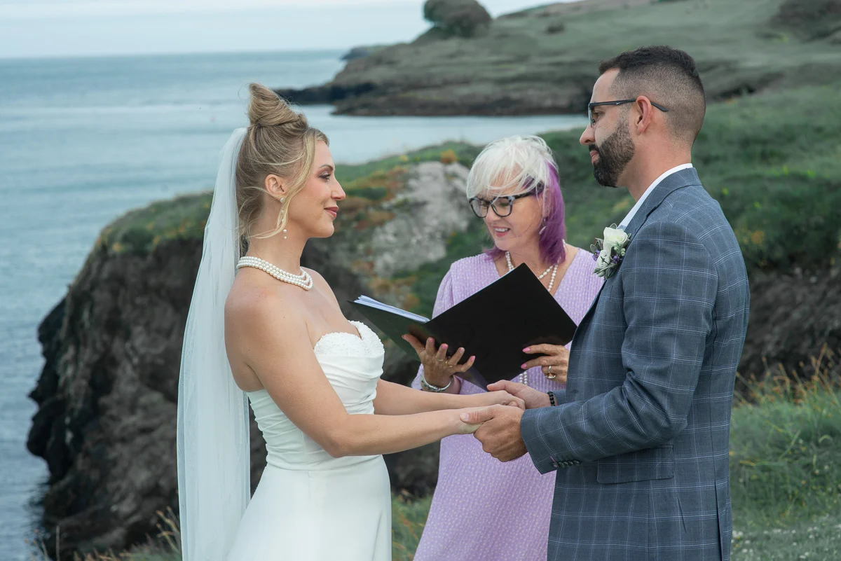 Bride and groom with celebrant during Ireland wedding ceremony