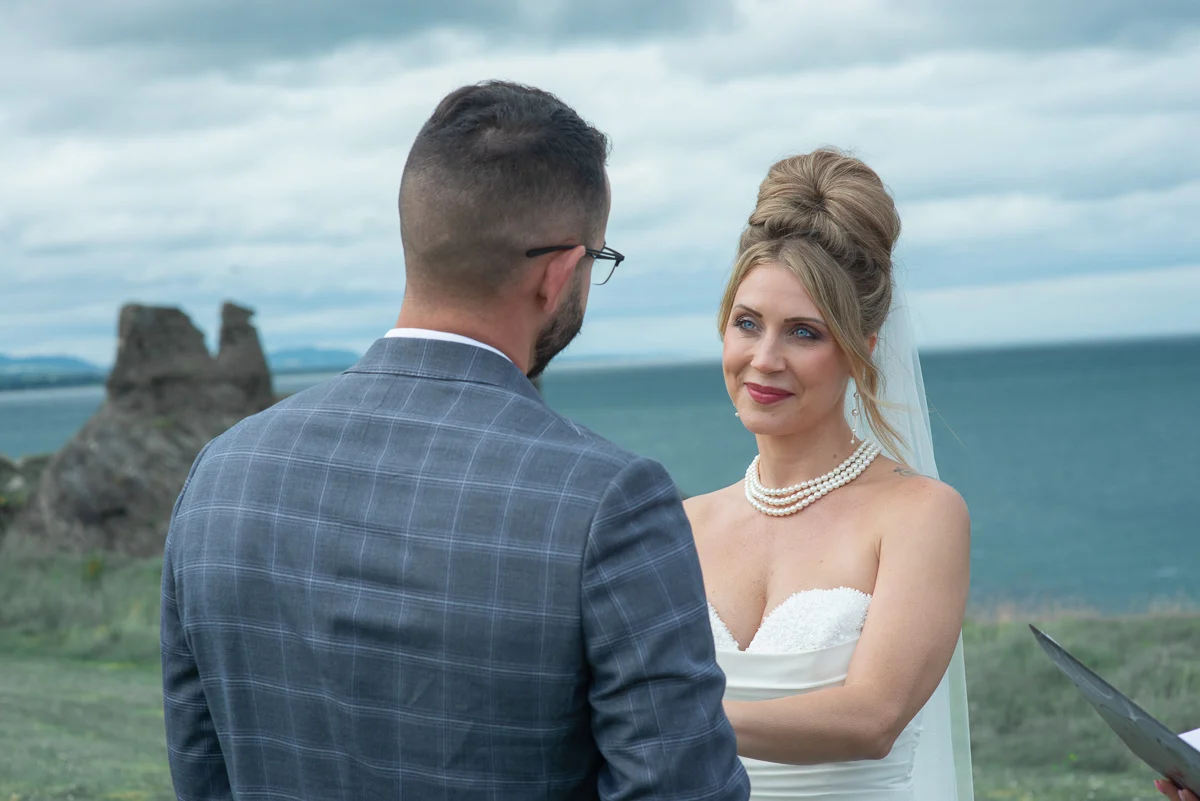 Couple exchanging personal vows Black Castle Ireland