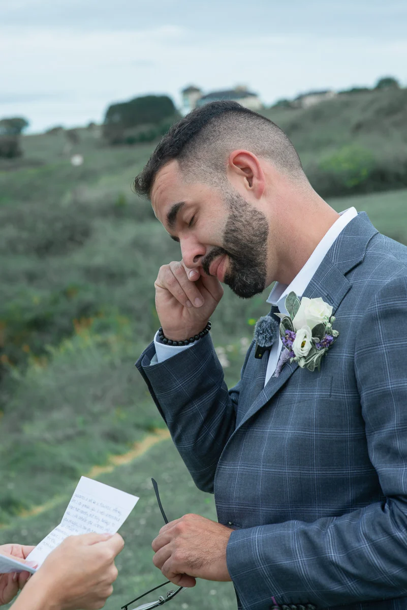 Groom emotional during personal vows Ireland wedding Black Castle