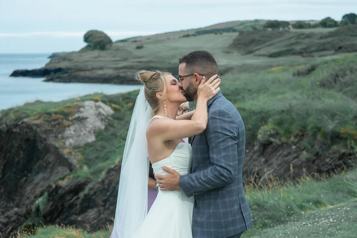 First kiss Ireland wedding ceremony at Black Castle cliff