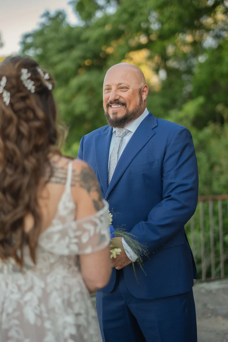 elopment at Fiesole, Tuscany-08 Groom smiling tenderly at his bride during their intimate elopement ceremony on a terrace in Fiesole, Tuscany