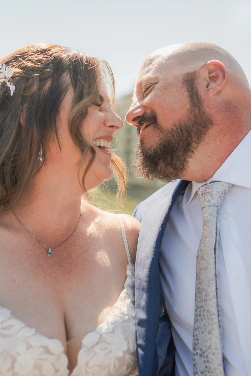 elopment at Fiesole, Tuscany-27 Close-up of bride and groom laughing nose to nose during their elopement photo session in Florence, Tuscany